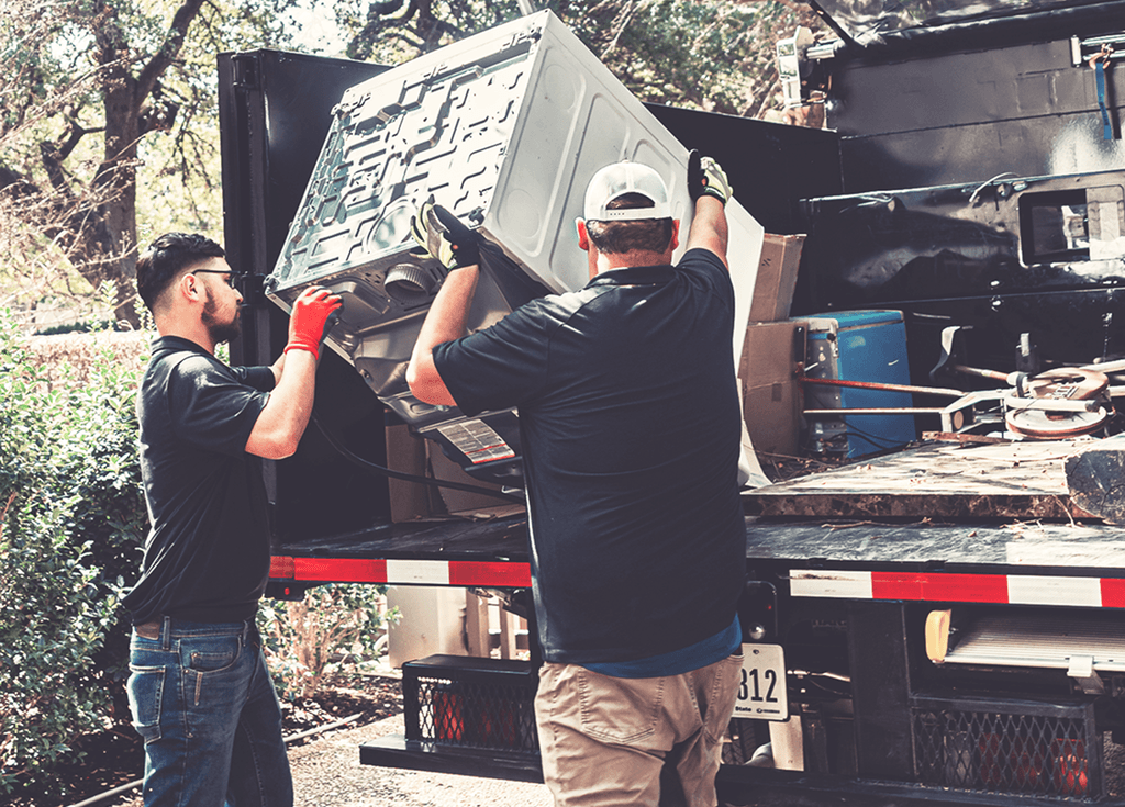 JunkStart crew loading items into a truck